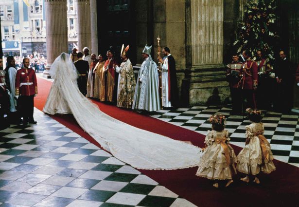Princess Diana on wedding to Prince Charles in Westminster abbey back image of long wedding dress train 