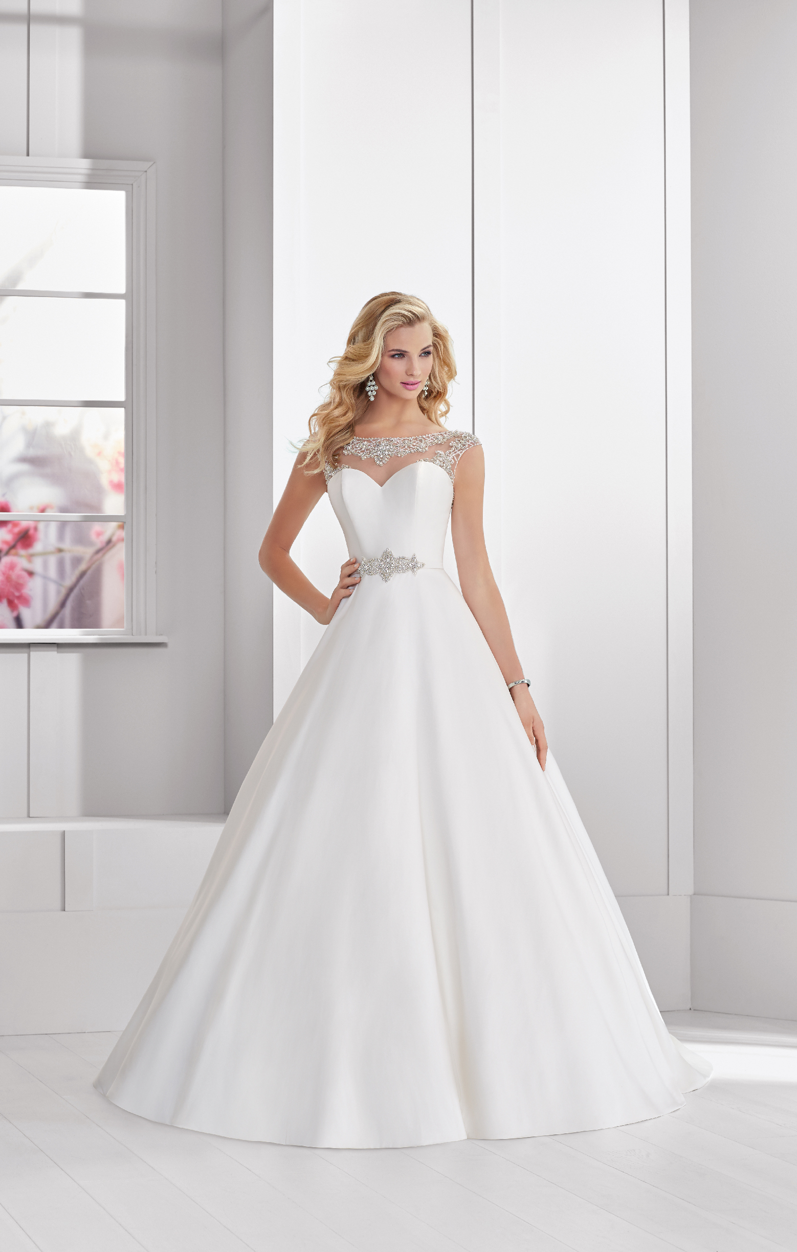 Model in Ronald Joyce wedding dress 69312 - a beautiful ballgown with an illusion sweetheart neckline and sparkle belt that's perfect if you need a wedding dress quickly.